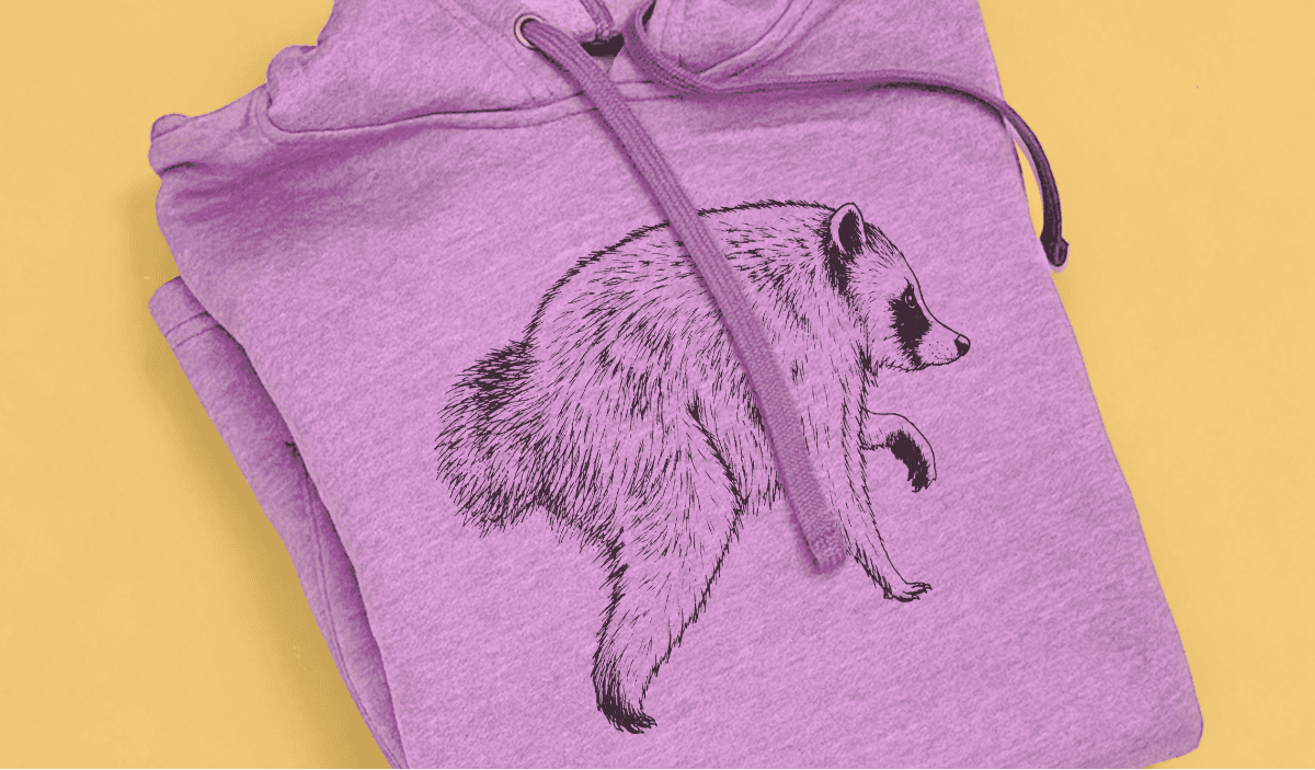 Purple hoodie decorated with a detailed raccoon illustration